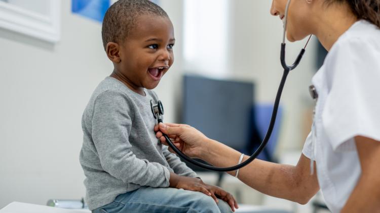 stock image of child and doctor in hospital
